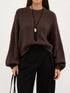 Oversized Chunky Knit Sweater worn with high-waisted jeans, showcasing cozy style and effortless fashion.